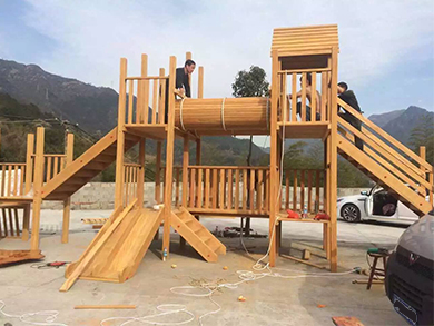 丽水某幼儿园定制户外非洲进口花梨木大型组合滑梯